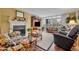 Bright living room with fireplace, hardwood floors, and large windows at 300 Carolina Ave # 304, Winter Park, FL 32789