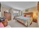 Comfortable main bedroom with neutral decor, wood furniture and a view from the window at 300 Carolina Ave # 304, Winter Park, FL 32789