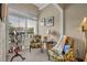 Cozy sitting area with two chairs and plenty of natural light coming through the windows at 300 Carolina Ave # 304, Winter Park, FL 32789