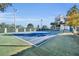 Outdoor tennis court alongside condominium building, providing recreational opportunities for residents at 300 Carolina Ave # 304, Winter Park, FL 32789