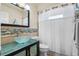 Bathroom featuring a glass vessel sink, modern fixtures, and stylish tile accents at 3606 Palm Ave, Apopka, FL 32703
