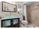 Updated bathroom with vessel sink, glass countertop, and walk-in shower at 3606 Palm Ave, Apopka, FL 32703