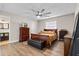 Bright bedroom features wood floors, ceiling fan, and classic wood furniture at 3606 Palm Ave, Apopka, FL 32703
