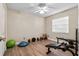The bedroom has wood floors and basic work out equipment at 3606 Palm Ave, Apopka, FL 32703