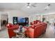 Inviting living room with vaulted ceilings, contemporary decor, and an abundance of natural light at 3606 Palm Ave, Apopka, FL 32703