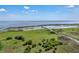Scenic aerial shot featuring a community wooden pier extending into a large lake with abundant greenery at 3966 Steer Beach Pl, Kissimmee, FL 34746