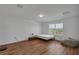 Bright bedroom featuring hardwood floors, a large window, and minimalist decor at 3966 Steer Beach Pl, Kissimmee, FL 34746