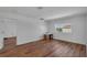 Bright bedroom features hardwood floors, a window, and closet with views of the surrounding neighborhood at 3966 Steer Beach Pl, Kissimmee, FL 34746