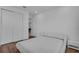 Clean bedroom features hardwood floors, white walls, and closet storage space at 3966 Steer Beach Pl, Kissimmee, FL 34746