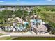 Aerial view of the resort style community pool, clubhouse, and amenity center at 3966 Steer Beach Pl, Kissimmee, FL 34746