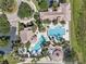 Aerial view of a large resort-style community pool and clubhouse at 3966 Steer Beach Pl, Kissimmee, FL 34746