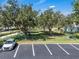 The community dog park is surrounded by large trees and provides a parking area for residents at 3966 Steer Beach Pl, Kissimmee, FL 34746