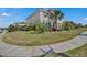 Expansive front lawn showcasing lush landscaping and mature trees at 3966 Steer Beach Pl, Kissimmee, FL 34746