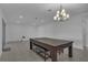 Open-plan living area featuring recessed lighting, tiled floor, and large game table with seating at 3966 Steer Beach Pl, Kissimmee, FL 34746