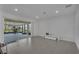 Bright living room featuring tiled floors, recessed lighting, and sliding glass doors at 3966 Steer Beach Pl, Kissimmee, FL 34746