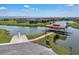 Waterfront home featuring a covered boat lift and dock with easy lake access at 3966 Steer Beach Pl, Kissimmee, FL 34746