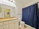 Bathroom featuring granite counters, ample storage, and a clean aesthetic at 430 Southern Pecan Cir # 101, Winter Garden, FL 34787