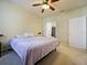 Serene bedroom showcasing neutral carpet, a ceiling fan, and a soothing ambiance at 430 Southern Pecan Cir # 101, Winter Garden, FL 34787