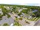 View of a gated community entrance with lush landscaping and well-maintained homes and palm trees at 430 Southern Pecan Cir # 101, Winter Garden, FL 34787