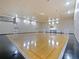 Spacious indoor gymnasium with basketball hoops, multiple entrances, and ample natural light at 430 Southern Pecan Cir # 101, Winter Garden, FL 34787