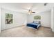 Cozy bedroom with carpet flooring and an abundance of natural light at 4448 Riverton Dr, Orlando, FL 32817