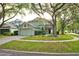 Charming home with mature landscaping, and an attached two-car garage at 4448 Riverton Dr, Orlando, FL 32817
