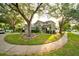 Two-story home with mature landscaping at 4448 Riverton Dr, Orlando, FL 32817