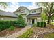 Two-story home with mature landscaping and covered entryway at 4448 Riverton Dr, Orlando, FL 32817