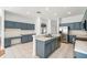 Modern kitchen features an island with a stainless steel sink, and updated appliances at 4448 Riverton Dr, Orlando, FL 32817