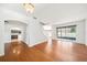 Open-concept living room featuring hardwood floors and abundant natural light at 4448 Riverton Dr, Orlando, FL 32817