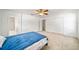 Main bedroom with ceiling fan, ensuite bathroom, and closet access at 4448 Riverton Dr, Orlando, FL 32817