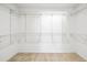 Spacious walk-in closet complete with wire shelving and carpet flooring at 4448 Riverton Dr, Orlando, FL 32817