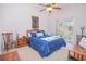 Cozy bedroom featuring vaulted ceilings, a ceiling fan, and a sliding glass door to the outside at 4541 Southfield Ave, Orlando, FL 32812