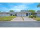 Well-maintained townhome features a lush front yard and an attached two-car garage at 4541 Southfield Ave, Orlando, FL 32812