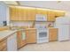 Eat-in kitchen showcasing cabinets, appliances, and tiled floors at 4541 Southfield Ave, Orlando, FL 32812
