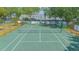 Aerial view of a fenced community tennis court surrounded by trees at 4541 Southfield Ave, Orlando, FL 32812
