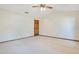 Large bedroom with neutral carpet, ceiling fan, and a large walk-in closet at 477 Eagle Brook Ct, Debary, FL 32713