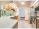 Bright kitchen with wood cabinets, stainless steel appliances and access to living areas at 477 Eagle Brook Ct, Debary, FL 32713