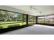Large screened porch overlooking the backyard with green lawn, offering serene outdoor living at 477 Eagle Brook Ct, Debary, FL 32713
