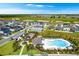 Aerial view of community amenities, including a pool, playground, and walking paths at 4792 Vellacito Way, Davenport, FL 33897