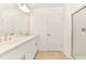 Bathroom featuring double sink vanity, stylish tile floor, and glass-enclosed shower at 4792 Vellacito Way, Davenport, FL 33897