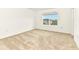 A bright bedroom with neutral carpet and a window at 4792 Vellacito Way, Davenport, FL 33897