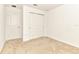 A bright bedroom with neutral carpet and a closet at 4792 Vellacito Way, Davenport, FL 33897