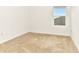 A bright bedroom with neutral carpet and a window at 4792 Vellacito Way, Davenport, FL 33897