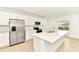 Bright kitchen featuring an island, stainless steel appliances, ample white cabinetry, and recessed lighting at 4792 Vellacito Way, Davenport, FL 33897