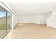 Expansive living room with sliding glass doors leading to the outdoors and neutral tile flooring at 4792 Vellacito Way, Davenport, FL 33897