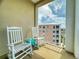 Relax on this condo balcony with rocking chairs, and enjoy the beautiful view of the intercoastal waterway at 5 Riverwalk Dr # 601, New Smyrna Beach, FL 32169