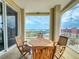 Outdoor seating area on the balcony with waterfront and coastal views at 5 Riverwalk Dr # 601, New Smyrna Beach, FL 32169