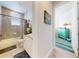Bathroom featuring a shower and tub combination with granite counters and tile at 5 Riverwalk Dr # 601, New Smyrna Beach, FL 32169