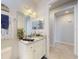 Bathroom featuring granite counters, vanity with mirror, and tiled floors at 5 Riverwalk Dr # 601, New Smyrna Beach, FL 32169